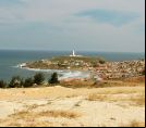 Farol de Santa Marta, aldea y Faro de fondo